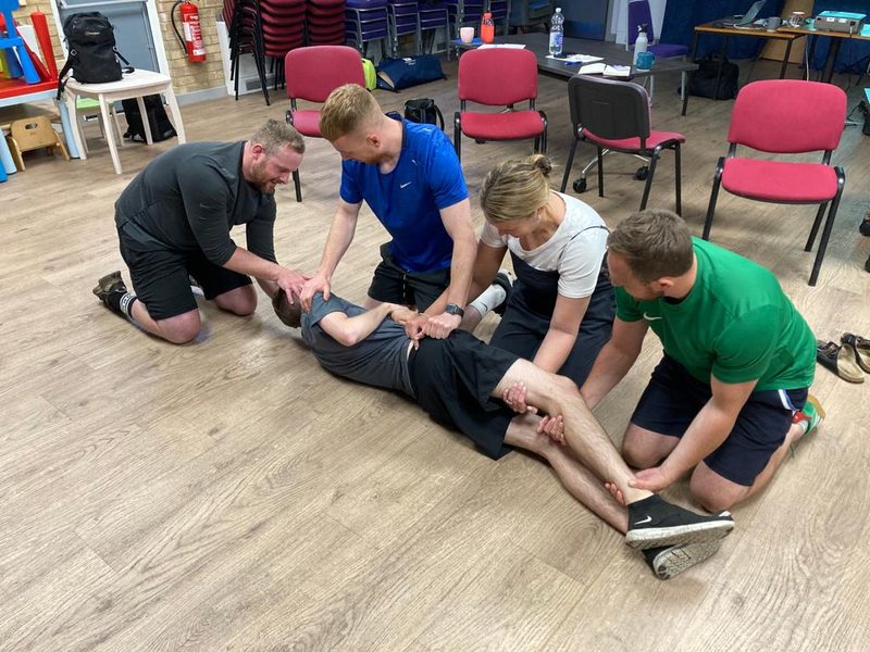 Hands-on bandaging practice during a first aid course in Manchester